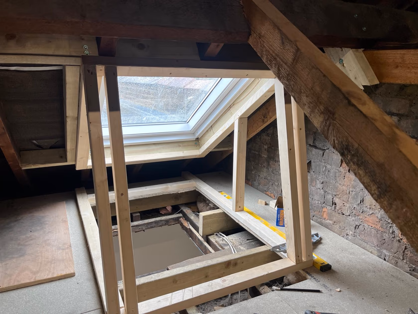 Timber framing for the light shaft built in the loft, connecting the new Velux roof window to the hallway ceiling opening below