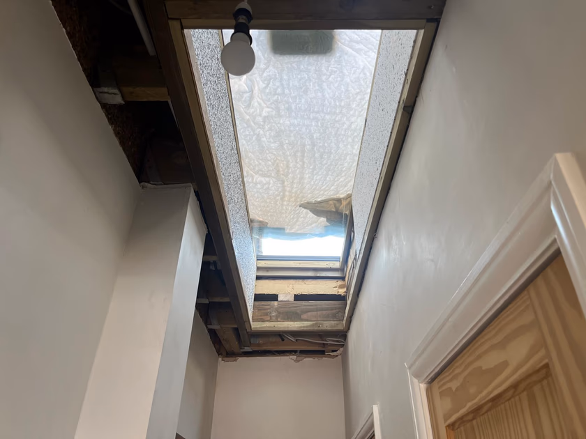Timber framing and insulation forming the light shaft between the hallway ceiling and the new rooflight