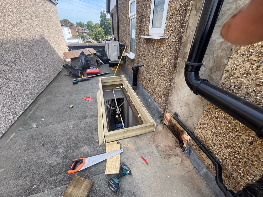 Treated timber upstand kerb built around the new rooflight opening on the flat roof